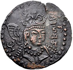 An early Turk Shahi ruler named Sri Ranasrikari "The Lord who brings excellence through war" (Brahmi script). In this realistic portrait, he wears the Turkic double-lapel caftan. Late 7th to early 8th century CE.[253][254][255]