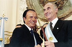Menem (left) with Fernando de la Rúa on 10 December 1999 just after the latter became president