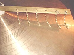 Paiste 2002 18" medium cymbal fitted with a chain sizzler.