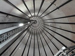 Inside view of a wind turbine tower, showing the tendon cables
