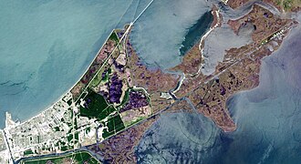 A Landsat view of New Orleans East. Note that dense development occurs exclusively in the western portion of eastern New Orleans; the remaining land is largely undeveloped swamp and marsh.
