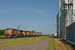 Two UP AC4400CWs, including an ex-CNW unit, lead a typical empty coal train west at Belvidere, Nebraska, in July 2015.