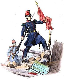 A soldier of the French Mobile Guard takes down the red flag from a barricade during the June Days