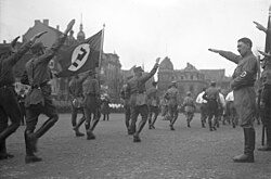 Nazi Party (NSDAP) leader Adolf Hitler saluting members of the Sturmabteilung in Brunswick, Lower Saxony, 1932