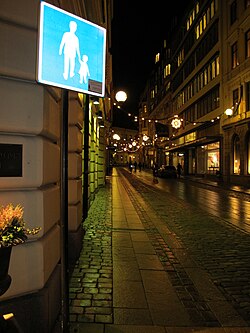 Sign for pedestrian street in Central Stockholm showing a father and daughter