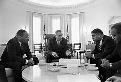 Johnson meeting with civil rights leaders Martin Luther King Jr. (left), Whitney Young, and James Farmer in 1964