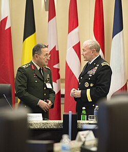 General Erdal Öztürk (left), shown here with U.S. Army Gen. Martin E. Dempsey, right, the chairman of the Joint Chiefs of Staff, was arrested over his reported involvement.
