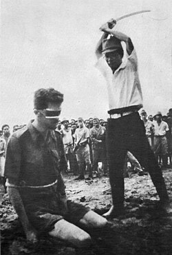 An Australian prisoner of war, Sergeant Leonard Siffleet, captured in New Guinea, about to be beheaded with a guntō by a Japanese officer, 1943.