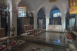 Chapel of the Order in the crypt of St Paul's Cathedral (photographed in 2013). The banners are those of the Sovereign (right) and of the Grand Master (left) of the Order as they were then in office.