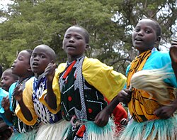 Kenyan boys and girls performing a traditional folklore dance