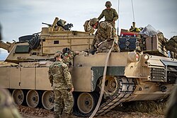 Refueling an M1A2 Abrams tank from a C-130J Super Hercules transport