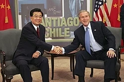 Hu Jintao of China and George W. Bush meet while attending an APEC summit in Santiago de Chile, 2004.