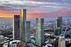 An aerial and skyline image of a city
