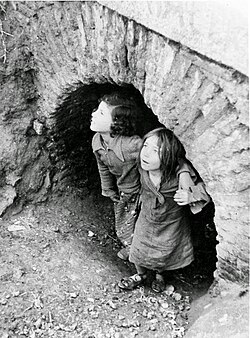 Children take refuge during the Francoist bombing over Madrid (1936–1937). Republicans managed to repel the siege despite the bombing.