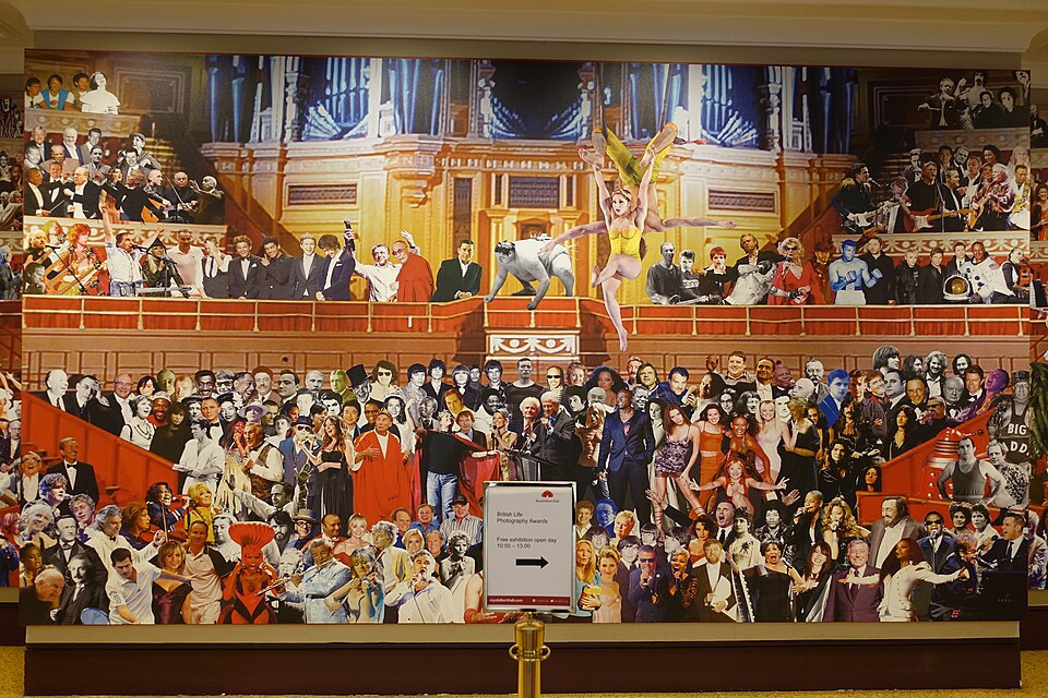 Appearing at the Royal Albert Hall (2014) is a specially commissioned mural by Sir Peter Blake. The work serves as a visual "who's who" of more than 140 years of culture at the venue, featuring over 400 notable figures who have appeared on its stage since 1871. Alongside musicians such as Bob Dylan, David Bowie, Jimi Hendrix, Adele, Beyoncé and Jay-Z, the mural also includes historical and cultural icons such as Albert Einstein, Sir Winston Churchill, Muhammad Ali, astronaut Buzz Aldrin, and even the fictional Dalek and wrestling legend Big Daddy.[41]