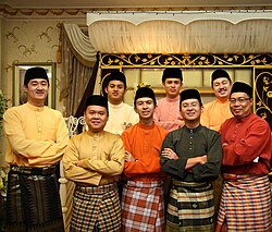 A group of men from Brunei Darussalam in the Cekak Musang type, worn together with the songket (far left) and kain sarong
