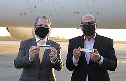 São Paulo State Secretary of Health Jean Gorinchteyn (left) and Instituto Butantan chairman Dimas Covas (right) holding single-dose prefilled syringes of CoronaVac, part of the fourth shipment of Sinovac-manufactured vaccine to arrive in Brazil