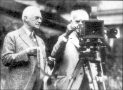 Eastman (L) giving Edison the first roll of movie film, which was 35 mm