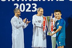 Odisha CM Naveen Patnaik handing the 2023 Intercontinental Cup trophy to Sunil Chhetri.