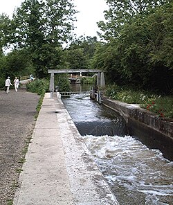 Flatford Lock, with the tilting weir being used to manage flood levels in the river
