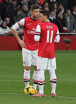 Giroud and Mesut Özil before kick-off against Southampton in November 2013