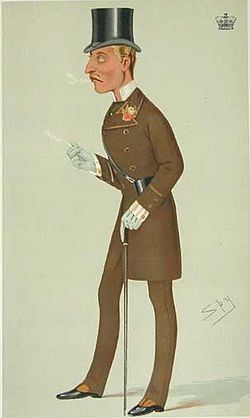 The Duke of Connaught in a braided frock coat suit with silk top hat, stand-up collar, cravat, buttonhole, striped shirt, gloves, button boots, cane and racing glasses, in a cartoon in Vanity Fair from 1876.