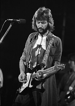 English guitarist, singer, and songwriter Eric Clapton is the only three-time inductee to the Rock and Roll Hall of Fame.