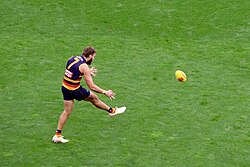 Thilthorpe kicks during the round 6, 2025 match against Greater Western Sydney