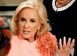 Being on the air since June 3, 1968, Almorzando con Mirtha Legrand (hosted by Mirtha Legrand, in the picture) has become Argentina's second longest-running show and one of the most popular since its premiere.[21]