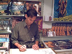 Ciruelo painting and signing at the Frankfurt Book Fair of 2007