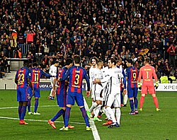 Players prepare for a free kick moments before Barcelona's sixth goal.