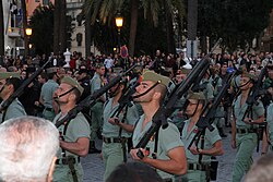 In many Christian countries, religious processions during the season of Lent are often accompanied by a military escort both for security and parade (Ceuta, Spain).
