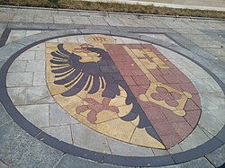 Coat of arms of Geneva as part of the pavement in front of the Reformation Wall, 2013