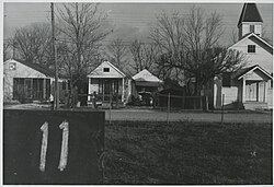 Battleground Baptist Church and neighboring shotgun-style houses, Fazendeville, Louisiana, 1960