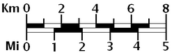 A graphical or bar scale. A map would also usually give its scale numerically ("1:50,000", for instance, means that one cm on the map represents 50,000 cm of real space, which is 500 meters).