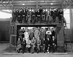 University of California Radiation Laboratory staff on the magnet yoke for the 60-inch cyclotron, 1938; Nobel prize-winners Ernest Lawrence, Edwin McMillan, and Luis Alvarez are shown, in addition to J. Robert Oppenheimer and Robert R. Wilson.