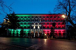Palazzo Margherita lit in the Italian flag colours to show solidarity during the COVID-19 pandemic on 26 March 2020