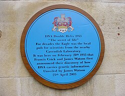 A blue plaque outside The Eagle pub in Cambridge, England commemorating Crick and Watson