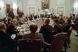 Reagan and Bush in a meeting to discuss the United States' invasion of Grenada with a group of bipartisan members of Congress in October 1983