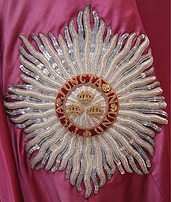 An embroidered representation, or "chaton", of the star of the civil division of the Order