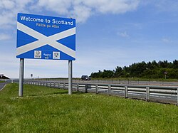 The Anglo-Scottish border, welcoming travellers in both English and Scottish Gaelic
