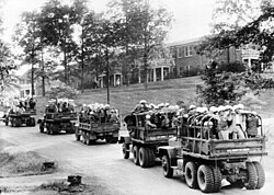 U.S. Army trucks loaded with Federal law enforcement personnel on the University of Mississippi campus, 1962.