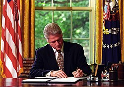 US President Bill Clinton signing cancellation letters related to his line-Item vetoes for the Balanced Budget Act of 1997
