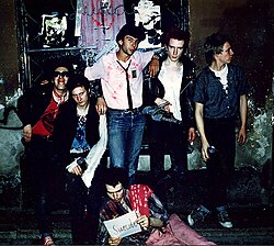 Thomas Dellert aka "Tommy Dollar", one of the early London punk rockers, standing with the Sex Pistols in 1975.