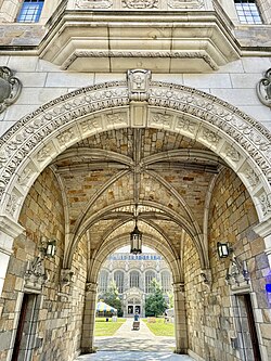 An archway leading into the Law Quadrangle from South University Avenue