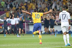 Ibrahimović celebrates after scoring with an acrobatic volley against France in June 2012. Like his idol Ronaldo, Ibrahimović often celebrated scoring a goal with both arms outstretched.[339]