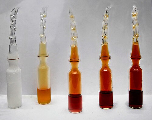 Nitrogen dioxide at −196 °C, 0 °C, 23 °C, 35 °C, and 50 °C. NO2 converts to colourless dinitrogen tetroxide (N2O4) at low temperatures, and reverts to NO2 at higher temperatures.