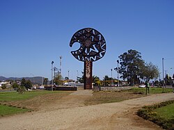 Monument in the form of a gigantic clava mere okewa, located in Avenida Presidente Eduardo Frei Montalva, Cañete, Chile
