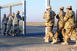 US and Kuwaiti troops closing the gate between Kuwait and Iraq on 18 December 2011