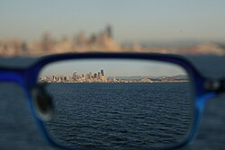 A skyline seen through a corrective lens, showing the effect of refraction